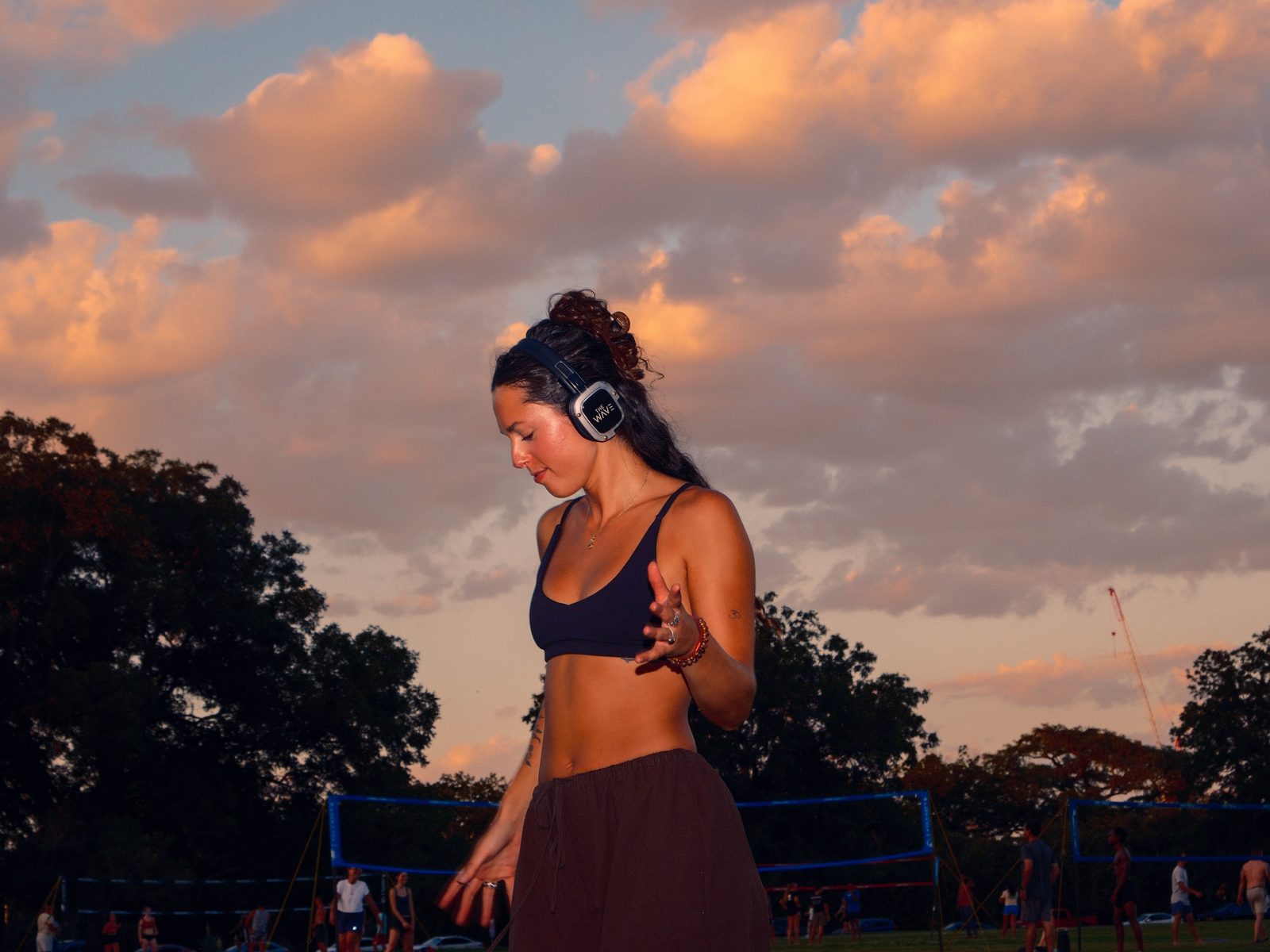 Dancer in headphones glowing in the sunset
