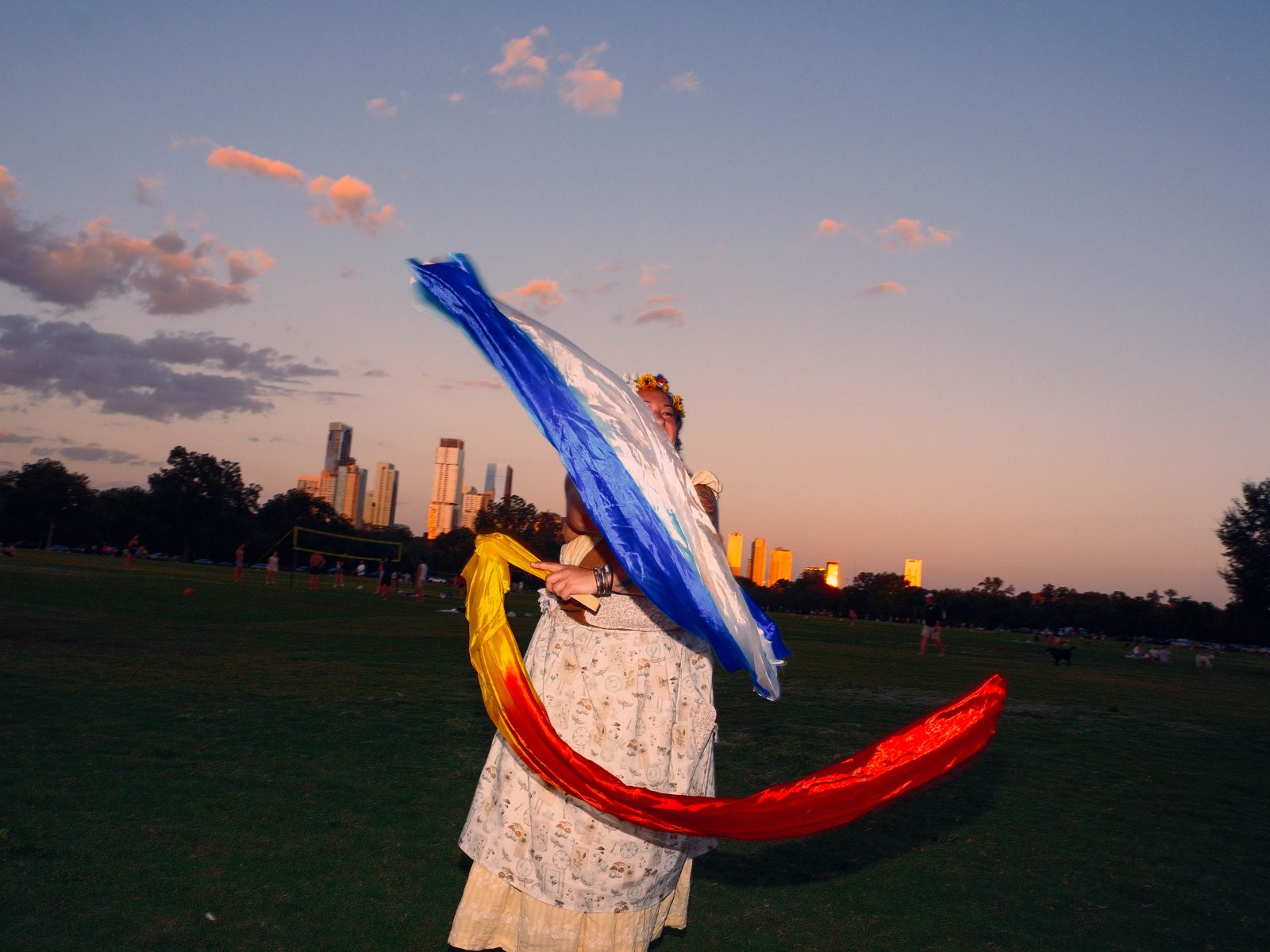 Dancer with a colorful ribbon against the skyline